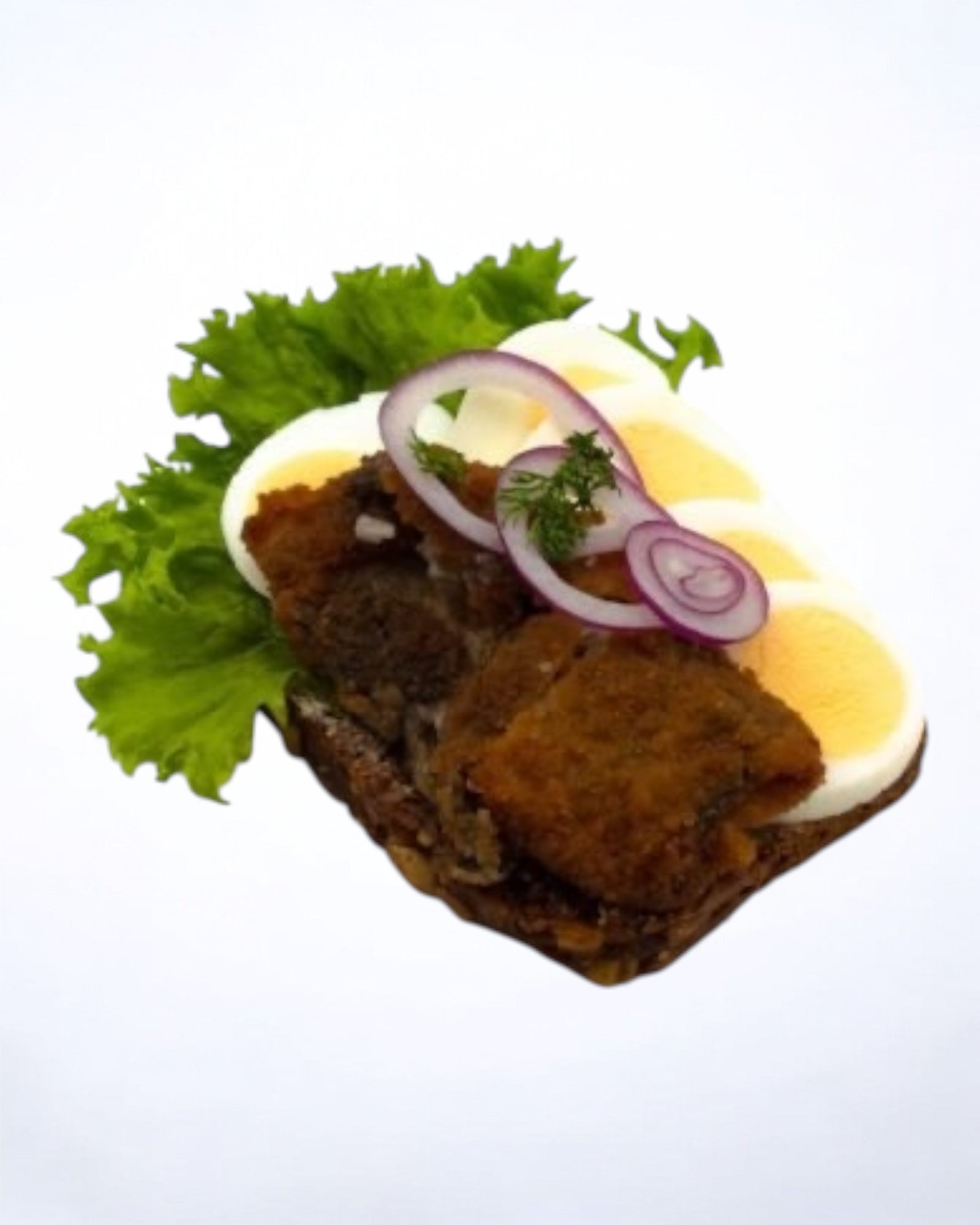 Stegtsild med æg og rødløg pyntet med grønt